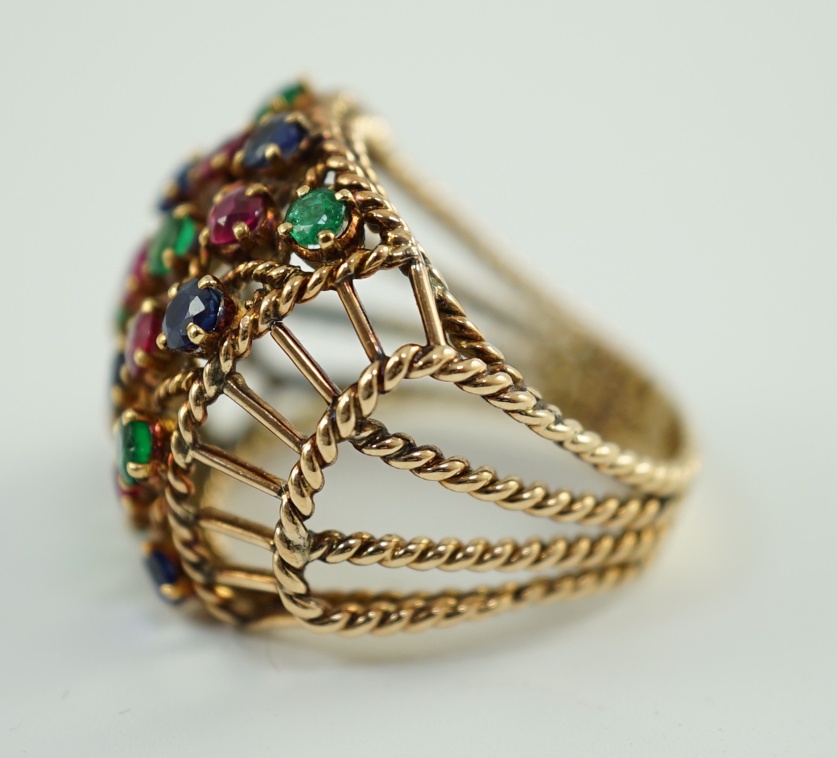 An Indian gold, ruby, sapphire and emerald cluster set dress ring